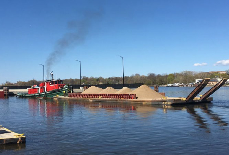2019 Great Lakes tug transporting the material barge